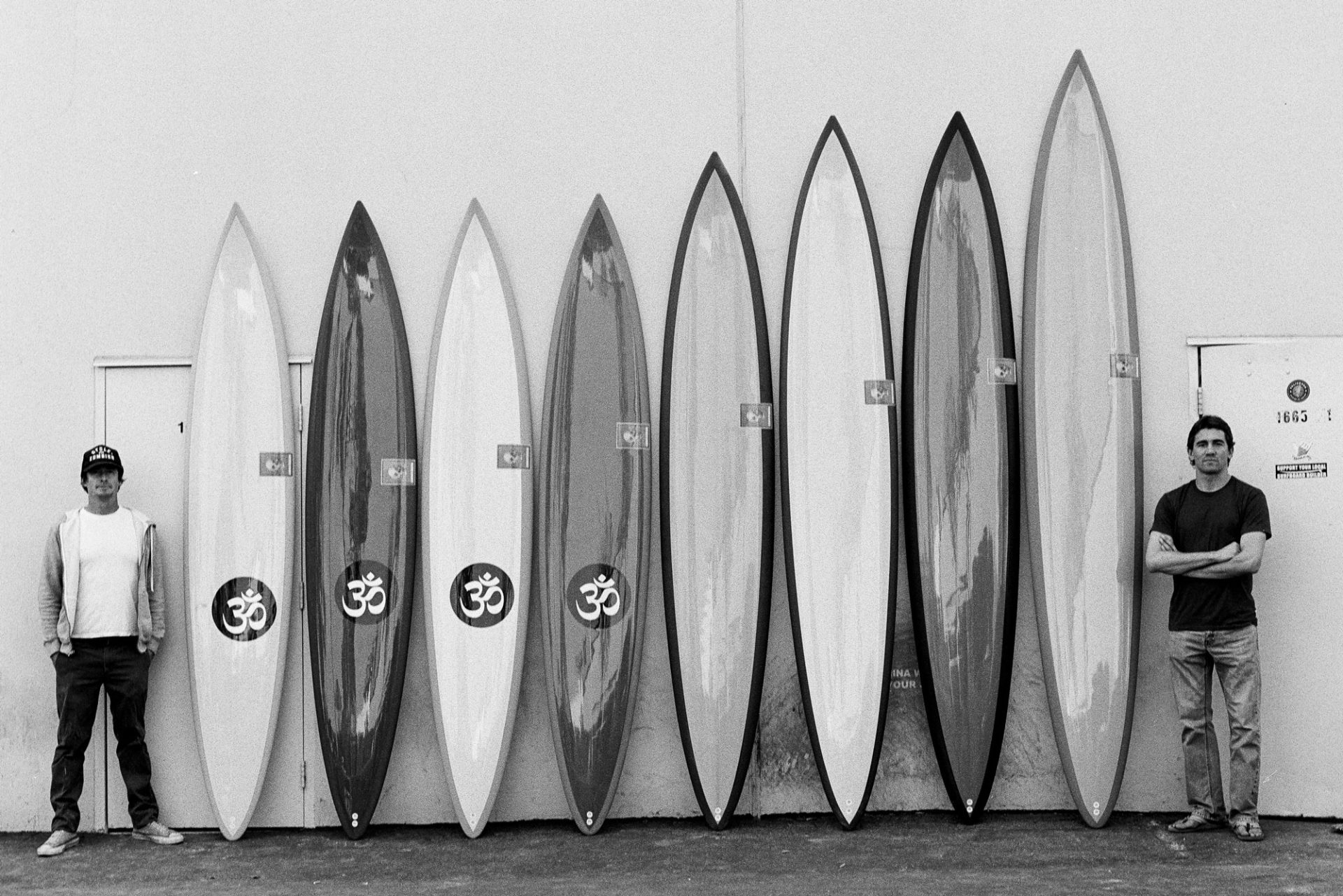 Chris and a quiver of his boards shaped for Greg Long.Photo: Todd Glaser